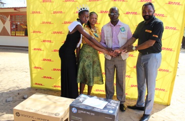 DHL Express Country Manager for Botswana, Mokgethi Magapa standing alongside Morama JSS ,PTA Chairperson Mr Gothaang, Morama Junior School head teacher Mrs. Lesego Phetwe and Miss Morama, Chenesani Sithole